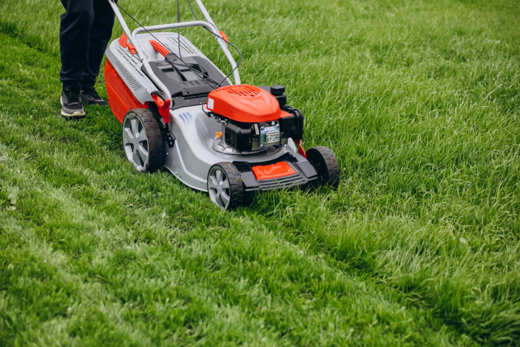 man-cutting-grass-with-lawn-mover-back-yard